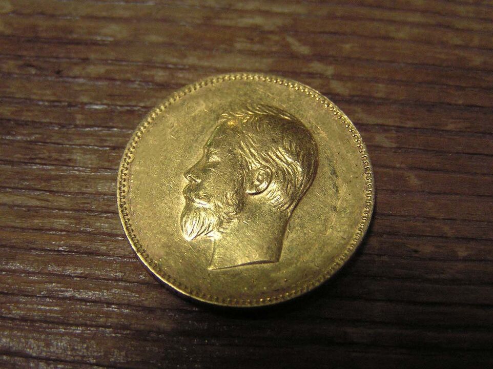 złota moneta dla dobrobytu finansowego